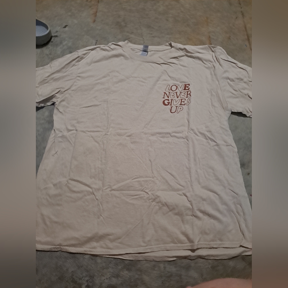 "Love Never Gives Up" graphic tshirt